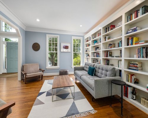 A balanced room layout utilizing soft natural light filtering through windows for daily reading comfort